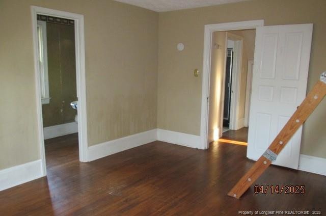 203 W 16th St, Lumberton, NC 28358 - spare room featuring wood finished floors and baseboards