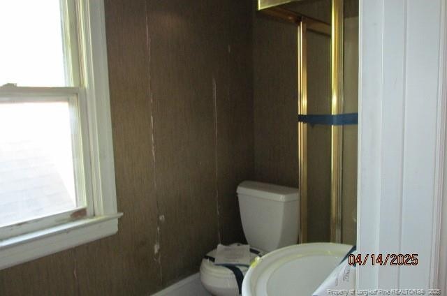 203 W 16th St, Lumberton, NC 28358 - bathroom featuring toilet and a shower stall