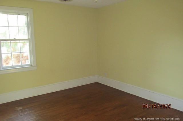 203 W 16th St, Lumberton, NC 28358 - empty room with plenty of natural light, baseboards, and dark wood finished floors