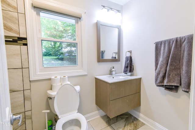 6409 Lakeland Dr, Raleigh, NC 27612 - bathroom featuring baseboards, toilet, and vanity