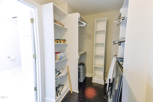 6409 Lakeland Dr, Raleigh, NC 27612 - spacious closet featuring dark wood-type flooring