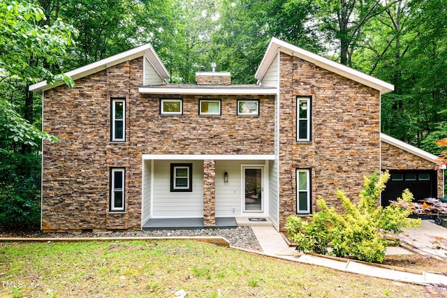 6409 Lakeland Dr, Raleigh, NC 27612 - mid-century home featuring a porch, a chimney, and a front yard
