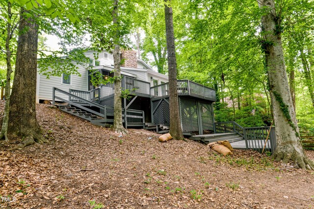 6409 Lakeland Dr, Raleigh, NC 27612 - back of house featuring a deck and stairway