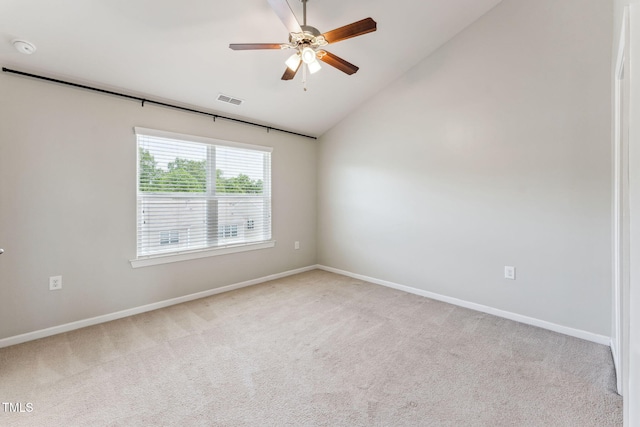 2027 Hayes Ln, Holly Springs, NC 27540 - carpeted spare room with vaulted ceiling, baseboards, and a ceiling fan