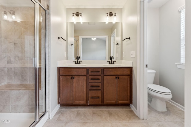 2027 Hayes Ln, Holly Springs, NC 27540 - full bath featuring double vanity, a stall shower, toilet, tile patterned floors, and baseboards