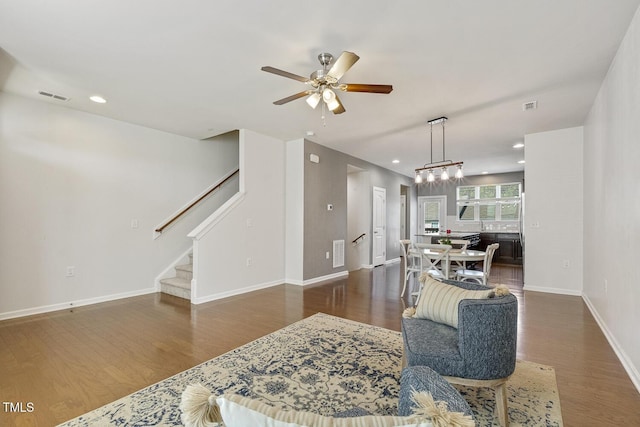 2027 Hayes Ln, Holly Springs, NC 27540 - living room with ceiling fan, wood finished floors, stairway, baseboards, and recessed lighting