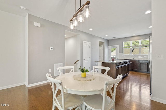 2027 Hayes Ln, Holly Springs, NC 27540 - dining room featuring dark wood-type flooring, baseboards, and recessed lighting