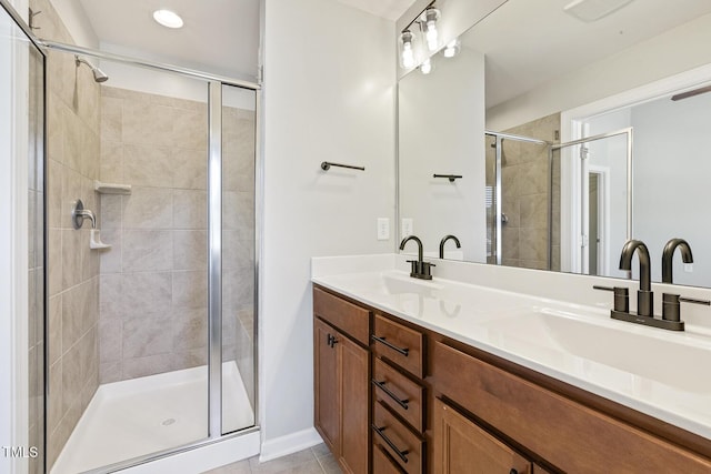 2027 Hayes Ln, Holly Springs, NC 27540 - full bathroom with double vanity, a stall shower, tile patterned flooring, and baseboards