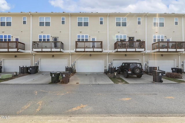 2027 Hayes Ln, Holly Springs, NC 27540 - rear view of house with an attached garage, driveway, and cooling unit