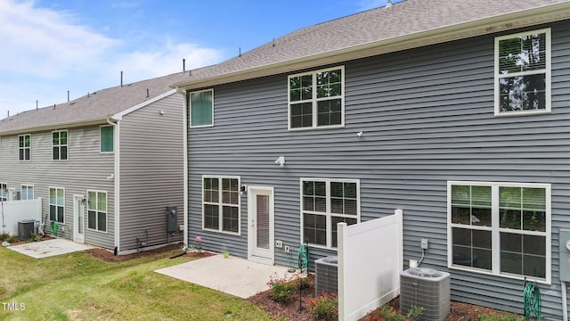 2211 Cherry Top Dr, Fuquay Varina, NC 27526 - rear view of property with a patio, central AC, a yard, and fence