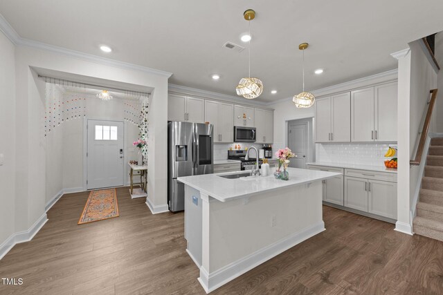 2211 Cherry Top Dr, Fuquay Varina, NC 27526 - kitchen with crown molding, a sink, appliances with stainless steel finishes, and dark wood-type flooring