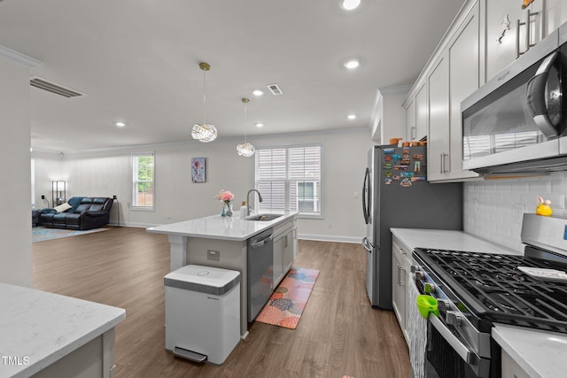 2211 Cherry Top Dr, Fuquay Varina, NC 27526 - kitchen featuring baseboards, open floor plan, dark wood-type flooring, a sink, and stainless steel appliances
