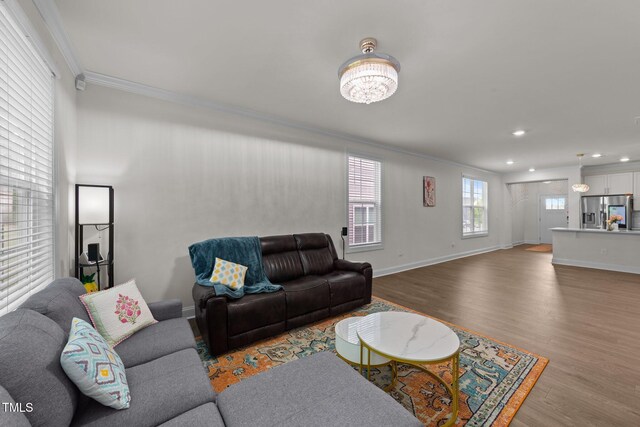 2211 Cherry Top Dr, Fuquay Varina, NC 27526 - living room with crown molding, baseboards, and light wood-type flooring