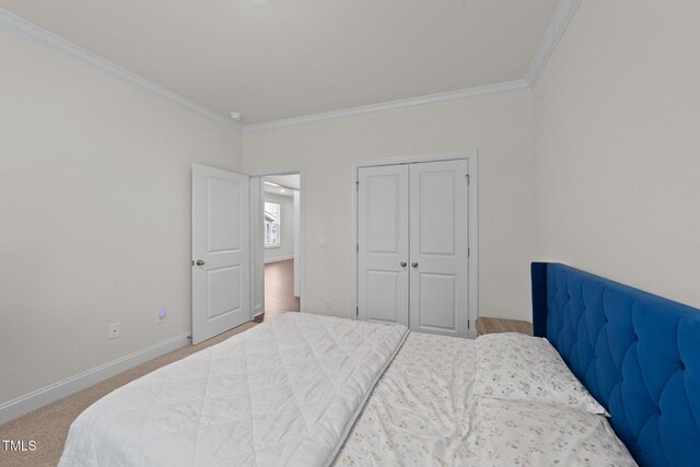 2211 Cherry Top Dr, Fuquay Varina, NC 27526 - carpeted bedroom featuring crown molding, baseboards, and a closet