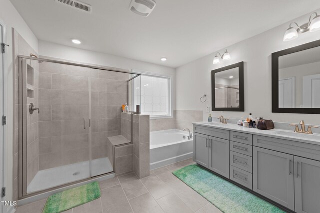 2211 Cherry Top Dr, Fuquay Varina, NC 27526 - bathroom with visible vents, a sink, a bath, and tile patterned floors