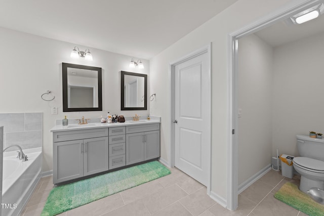 2211 Cherry Top Dr, Fuquay Varina, NC 27526 - bathroom featuring double vanity, a sink, a bath, and toilet