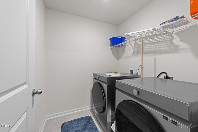 2211 Cherry Top Dr, Fuquay Varina, NC 27526 - laundry room with washer and dryer, light tile patterned flooring, laundry area, and baseboards
