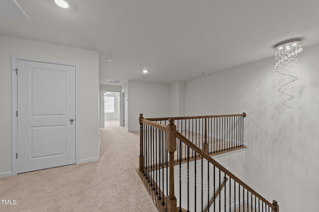 2211 Cherry Top Dr, Fuquay Varina, NC 27526 - hallway featuring visible vents, carpet flooring, baseboards, and an upstairs landing