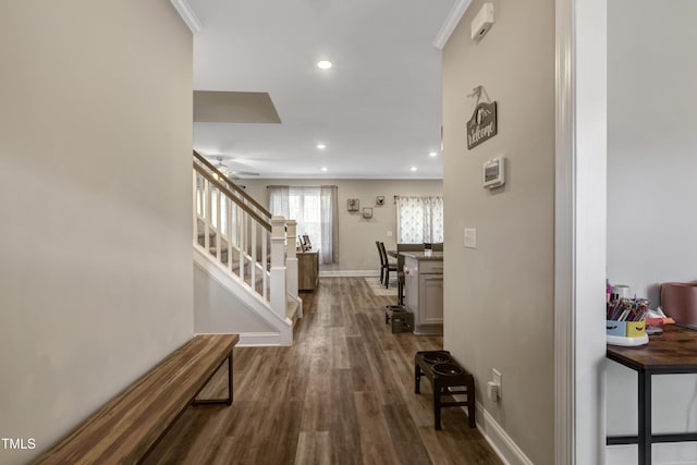 hall with baseboards, recessed lighting, dark wood-style floors, crown molding, and stairs
