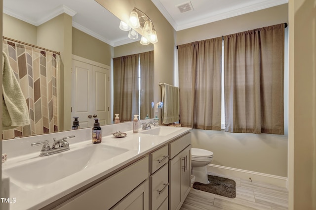 full bath featuring toilet, crown molding, a sink, and visible vents