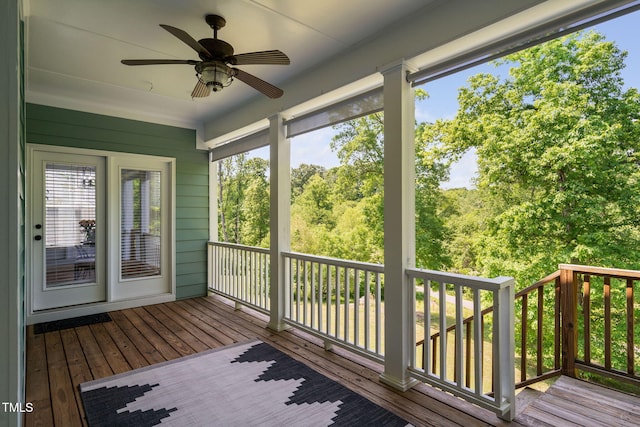 wooden deck featuring ceiling fan