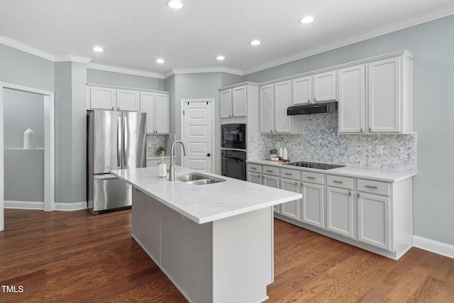 304 Nelson Ln, Clayton, NC 27527 - kitchen with dark wood finished floors, a sink, black appliances, under cabinet range hood, and white cabinetry