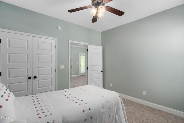 bedroom featuring baseboards, carpet flooring, ceiling fan, and a closet