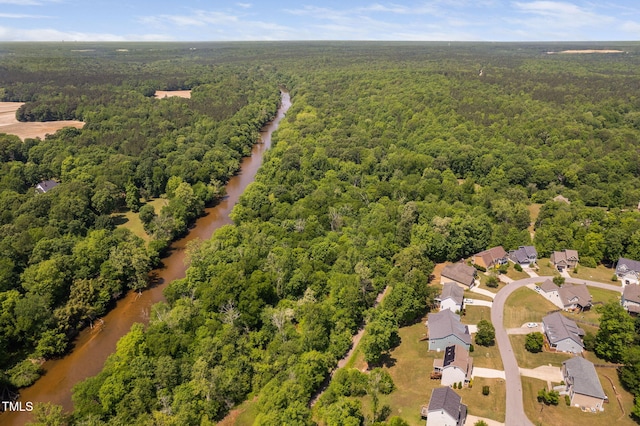 bird's eye view with a water view and a view of trees