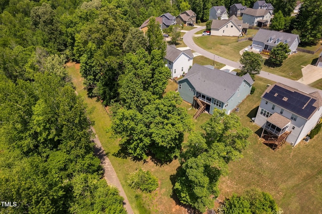 birds eye view of property with a residential view
