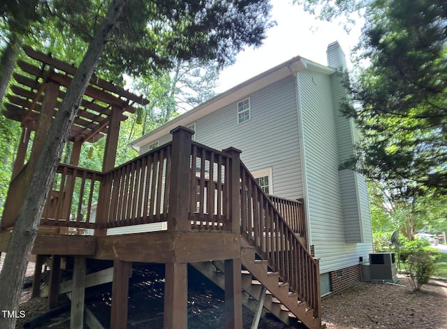 109 Elmview Dr, Cary, NC 27519 - rear view of property with a wooden deck, a chimney, central AC unit, and crawl space