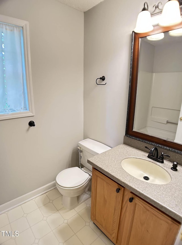 109 Elmview Dr, Cary, NC 27519 - bathroom featuring toilet, vanity, and baseboards