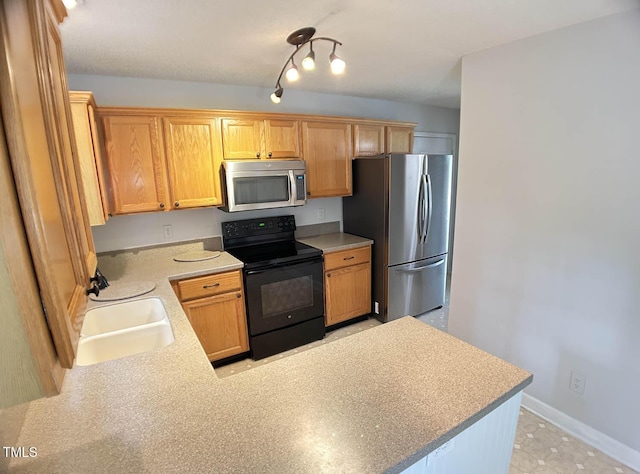 109 Elmview Dr, Cary, NC 27519 - kitchen with appliances with stainless steel finishes, a sink, light countertops, a peninsula, and baseboards