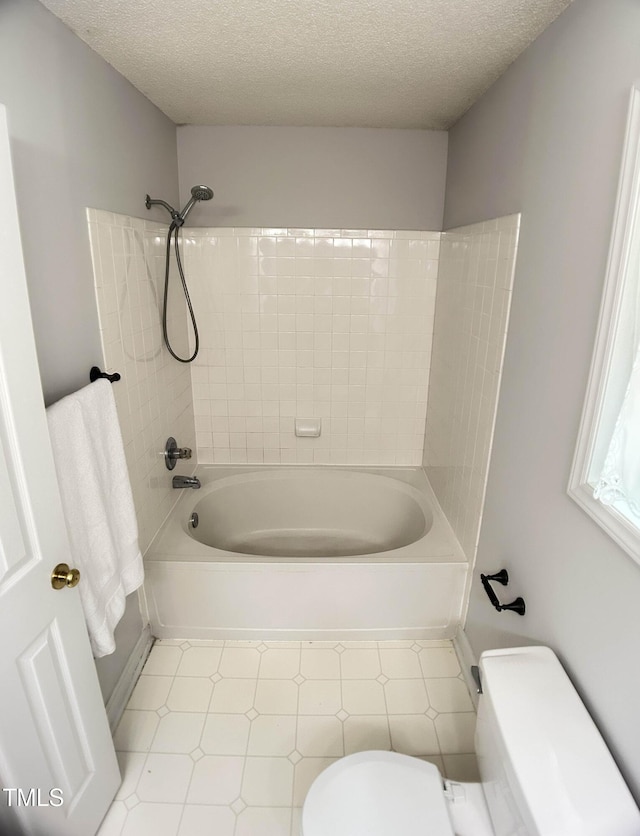 109 Elmview Dr, Cary, NC 27519 - full bathroom featuring toilet, tub / shower combination, a textured ceiling, and tile patterned floors