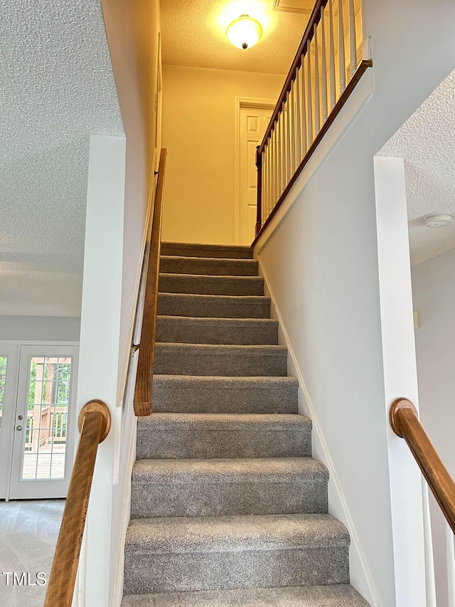 109 Elmview Dr, Cary, NC 27519 - stairway featuring a textured ceiling and carpet flooring
