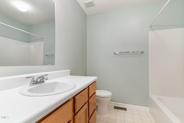 bathroom featuring toilet, vanity, a textured ceiling, and visible vents