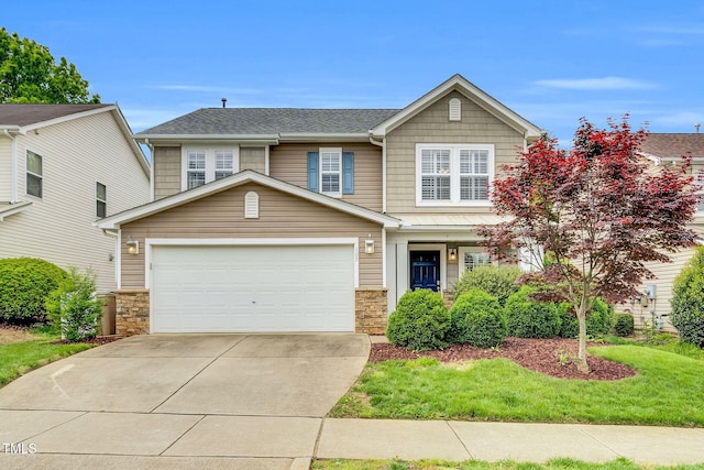 105 Ryder Cup Cir, Raleigh, NC 27603 - view of front of home featuring concrete driveway, stone siding, a garage, and roof with shingles