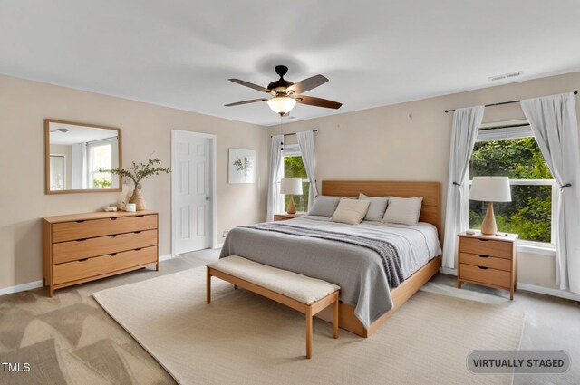 105 Ryder Cup Cir, Raleigh, NC 27603 - bedroom with light colored carpet, baseboards, and ceiling fan