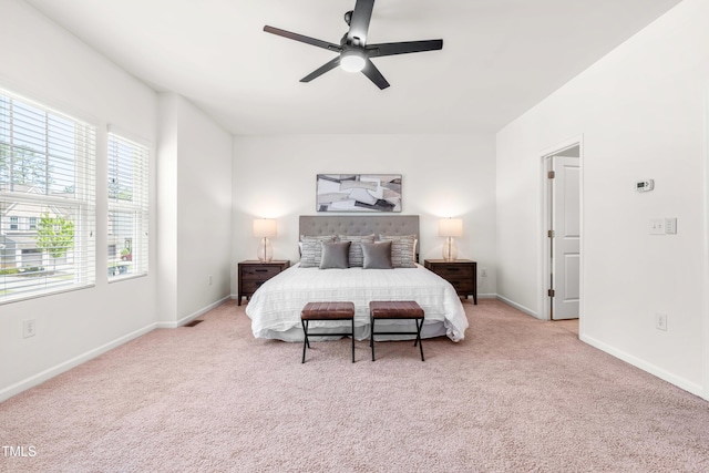 carpeted bedroom featuring baseboards and ceiling fan