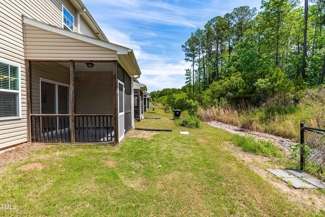 view of yard featuring a sunroom