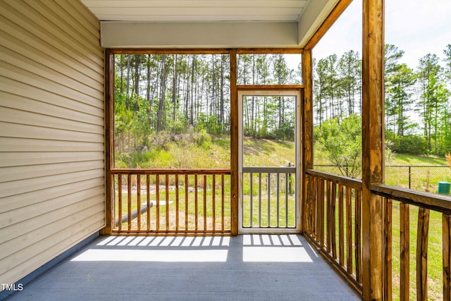 unfurnished sunroom with plenty of natural light