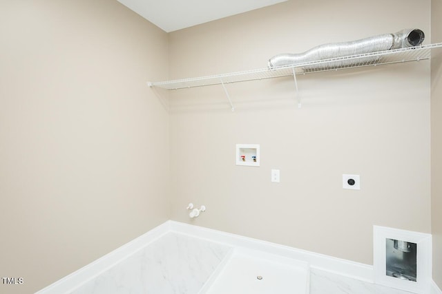 laundry room featuring hookup for an electric dryer, gas dryer hookup, hookup for a washing machine, and laundry area