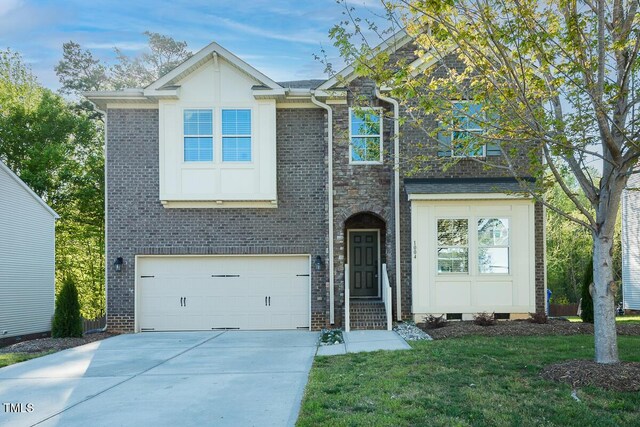 traditional-style home with an attached garage, a front lawn, brick siding, and concrete driveway