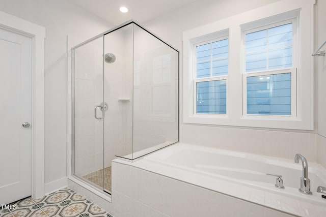 bathroom with recessed lighting, tile patterned flooring, a garden tub, and a stall shower