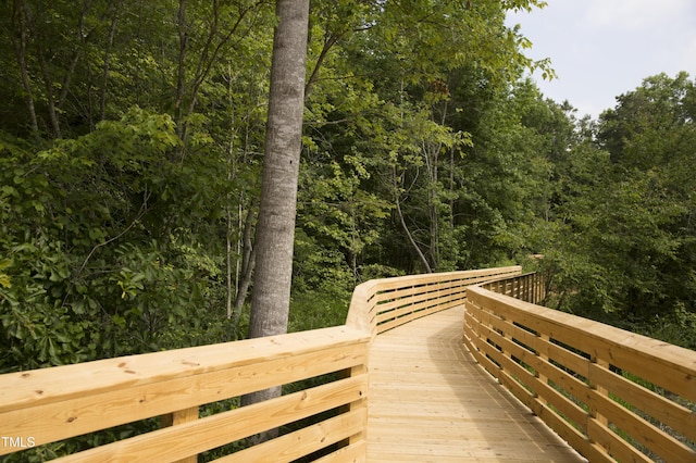 surrounding community featuring a view of trees