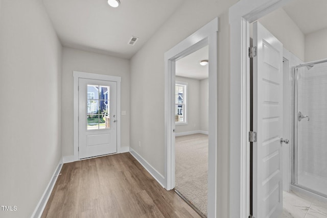 1245 Porters Call Dr, Wendell, NC 27591 - foyer with baseboards and light wood finished floors