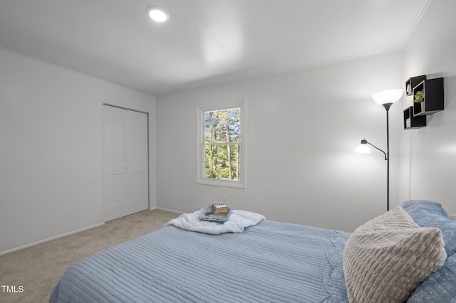 bedroom featuring baseboards, carpet flooring, and crown molding