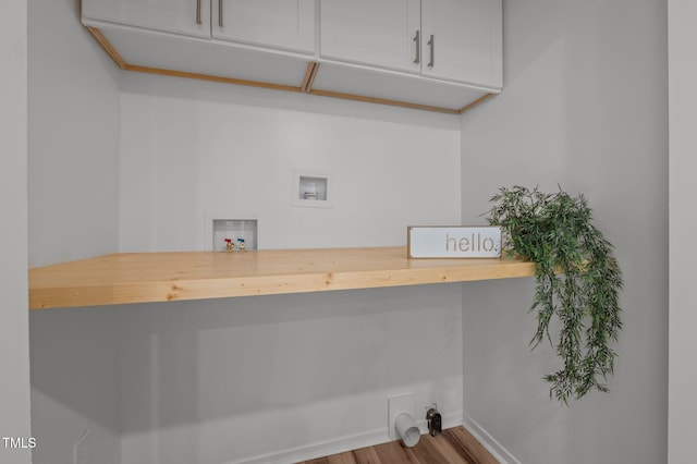 laundry room with wood finished floors, baseboards, electric dryer hookup, cabinet space, and washer hookup