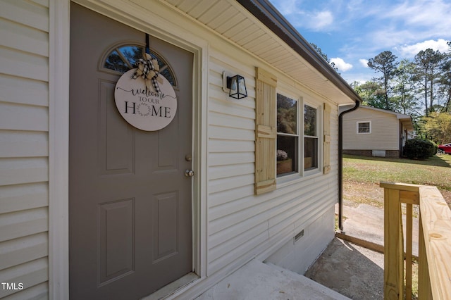 view of exterior entry with crawl space