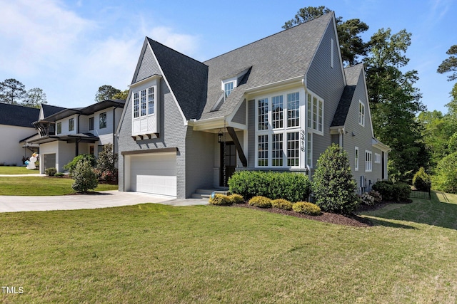 3416 Edgemont Dr, Raleigh, NC 27612 - view of front of property with driveway, a shingled roof, a front yard, an attached garage, and brick siding