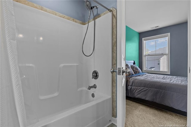 ensuite bathroom with ensuite bathroom, visible vents, and shower / bath combination with curtain